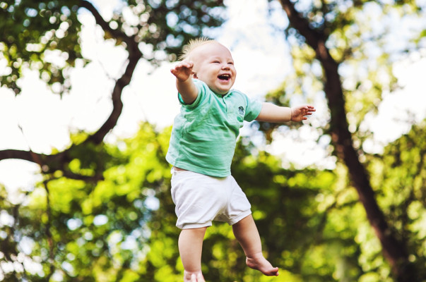Smiling toddler jumping