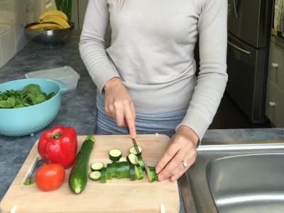 Dietitian cutting up vegetables